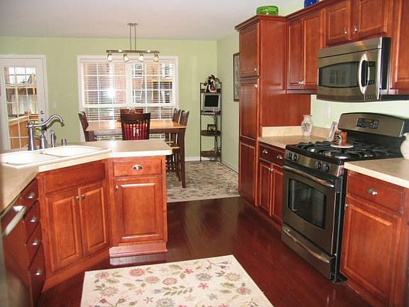 Beautiful updated kitchen with cherry hardwood floors and maple cabinets