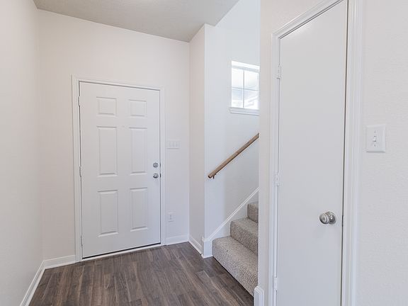 Front Door and stairway to upstairs.