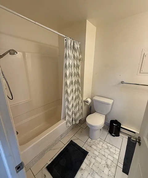 Spacious and impeccably clean bathroom.