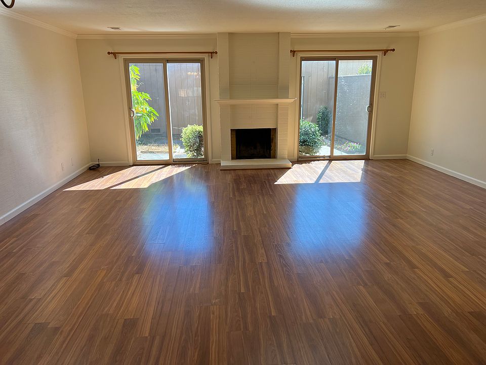 Living and dining space looking out to private patio