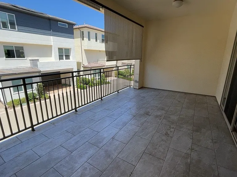 2nd floor - Great room - Kitchen, living room, under-stair storage, bathroom, balcony/patio