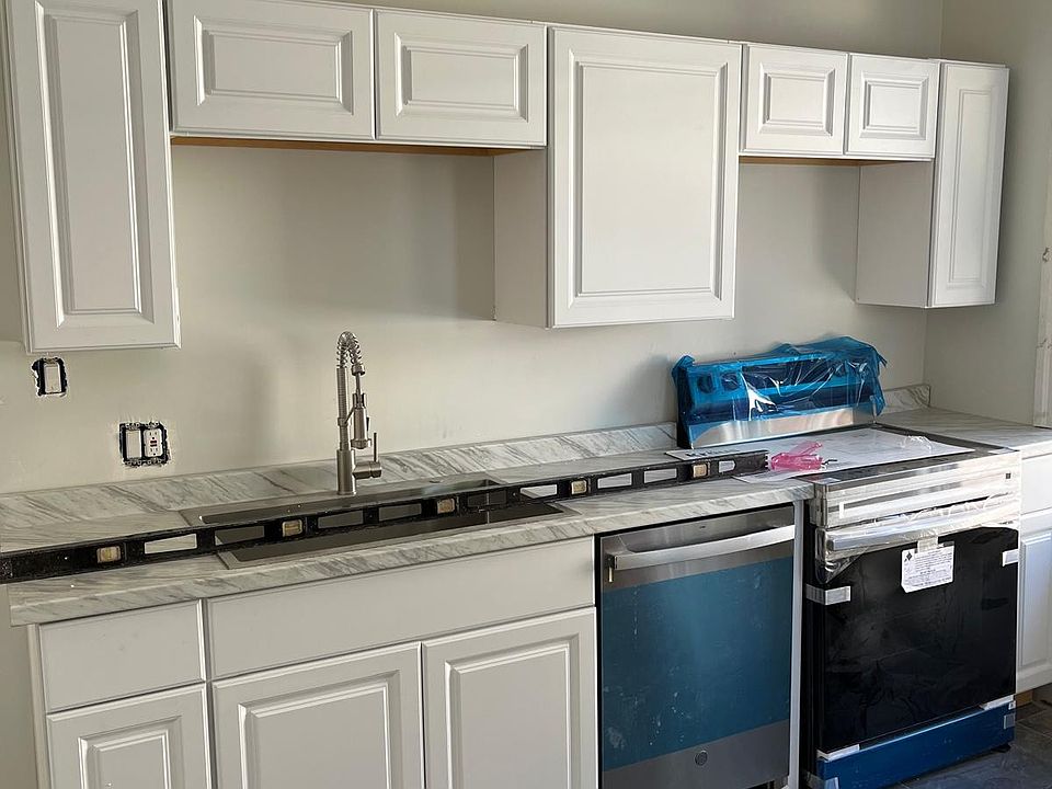 Brand New Kitchen with premium appliances, ceramic tiled floor, fresh paint and separate laundry room!
