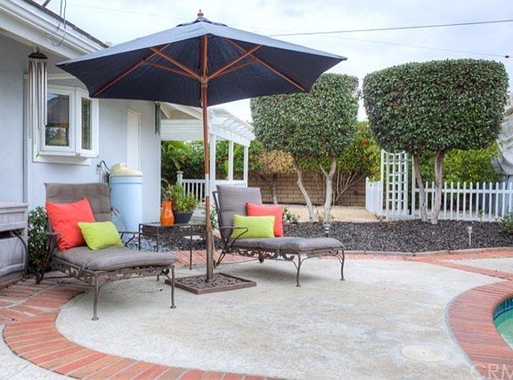 Huge backyard includes pool, spa, deck, patio, fruit trees, RV shelter and more!