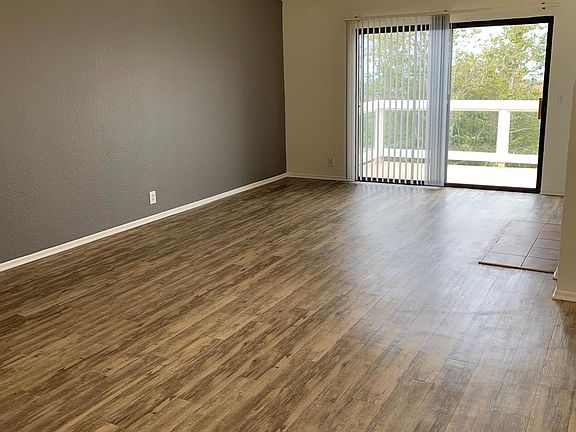 Living Room/Dining Room with high Vaulted Ceilings