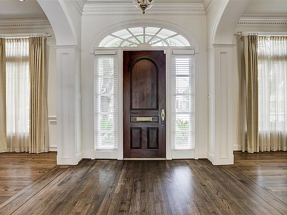Hardwood floors start in the entry and flow throughout the main level, with exception of beautiful stone floors in the kitchen area.
