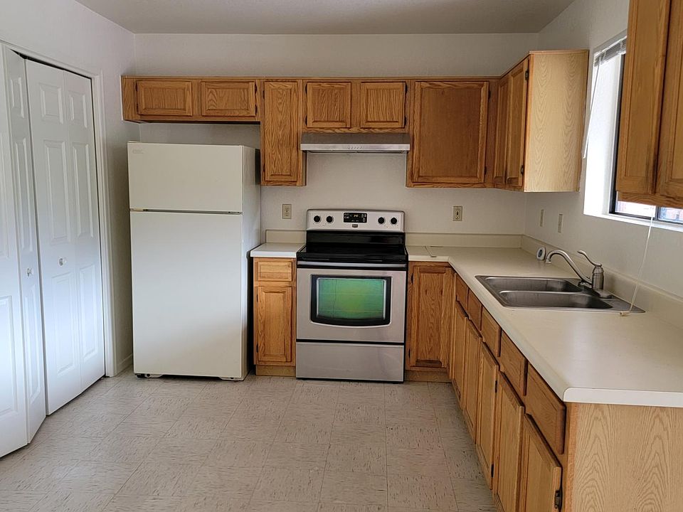 Kitchen with enclosed laundry area