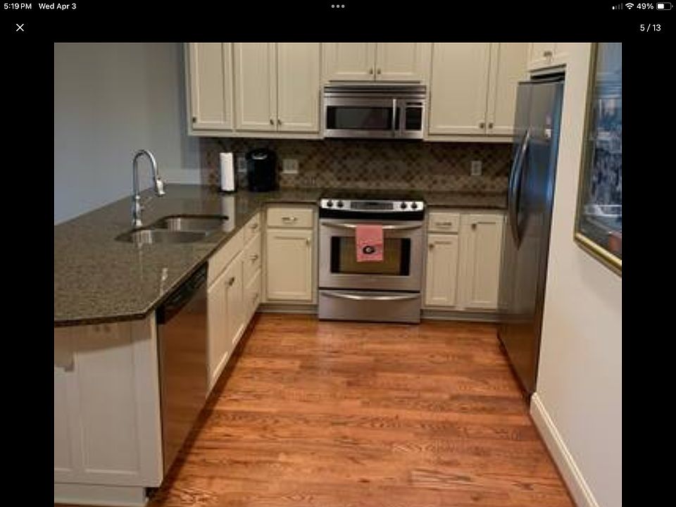 Open Kitchen with Stainless Steel Appliances.