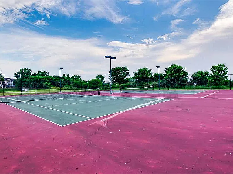 A dual tennis court is among the many amenities available to residents.