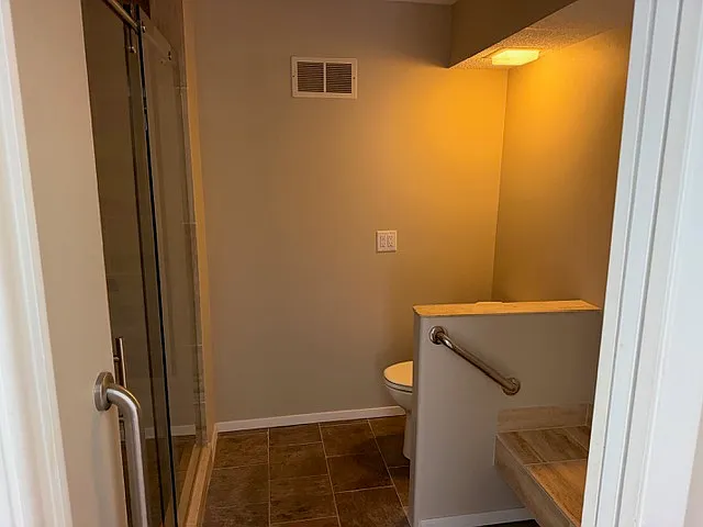 Ensuite toilet and shower area separate from double vanity