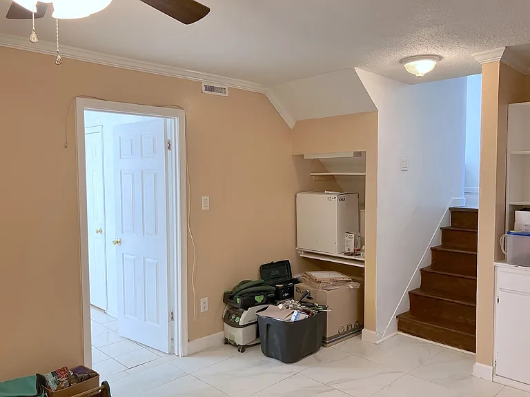 Spacious ground level family room with ceiling fan. Could be ideal for roommates wanting separate living/bed/bath spaces.