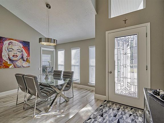 The formal dining room can easily be used for an office, play room or sitting area.