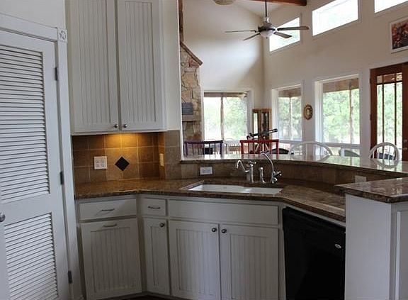 Pantry in closet, breakfast bar, open to living and dining.