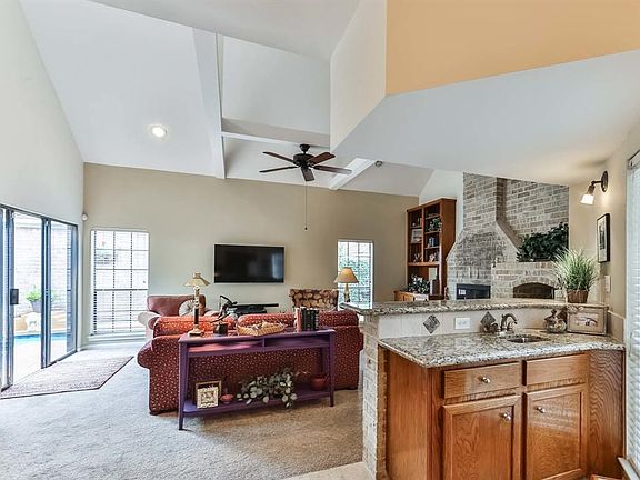 The living room is located to the right when entering this charming home.