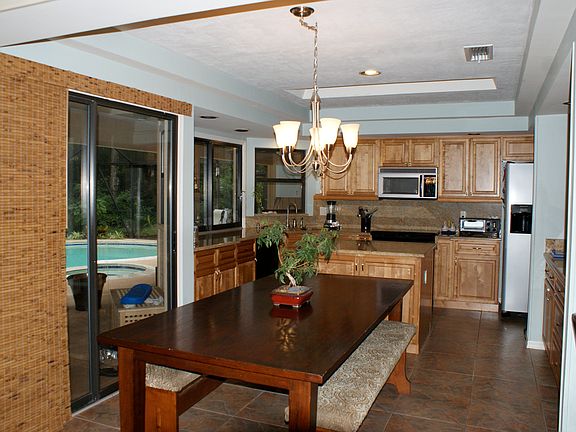 Kitchen overlooks the pool 