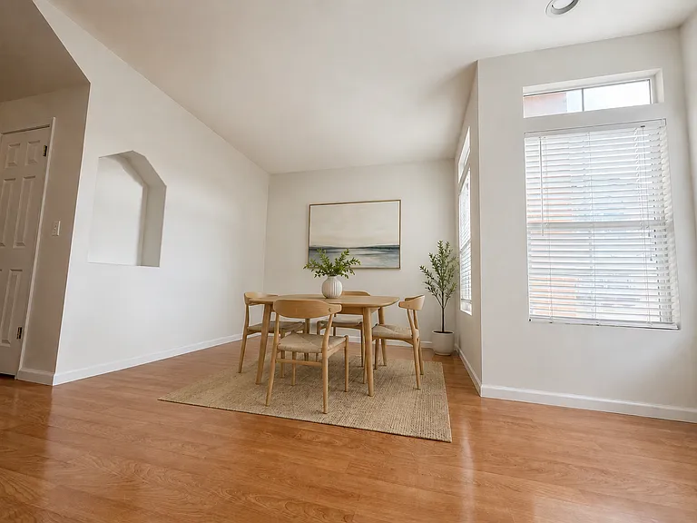 Dining Room - Photo digitally staged for visual context. Swipe to see empty space!