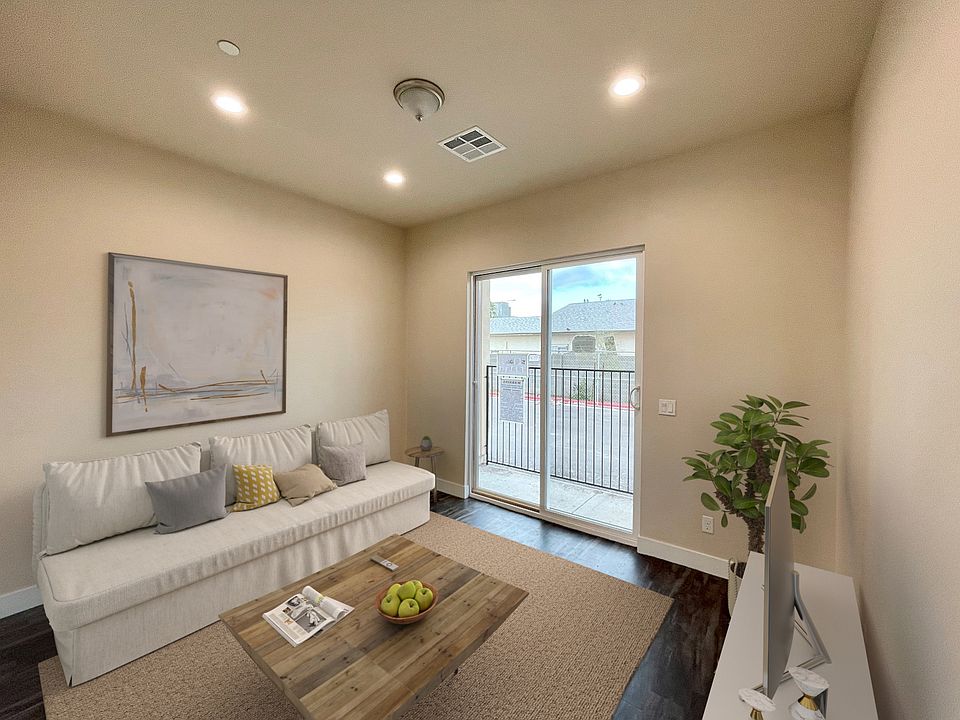 First Floor Living Room, perfect for an in-law suite, roommate or additional flex space. In the hallway entrance there is also a nook to add additional storage or utilize as a work space.