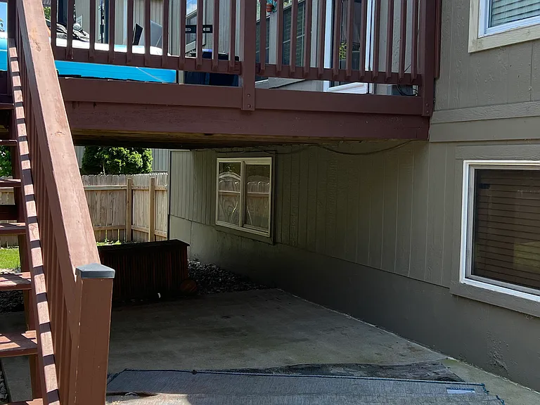 View of the deck from the yard - nice concrete slab as well