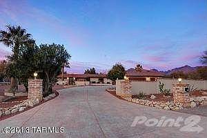BEAUTIFUL DRIVEWAY LEADS TO CUSTOM HOME