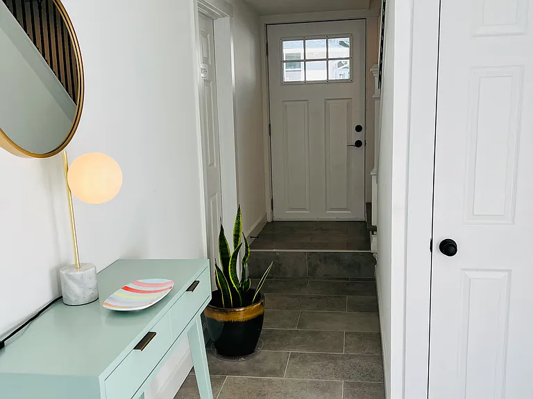 Dual entry on the first floor with hallway closet. Living space on the second floor.