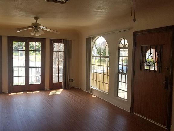 spacious dining area off the kitchen with french doors to a balcony
