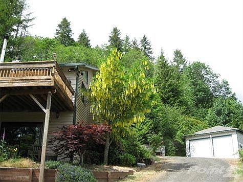 Side of house and RV garage
