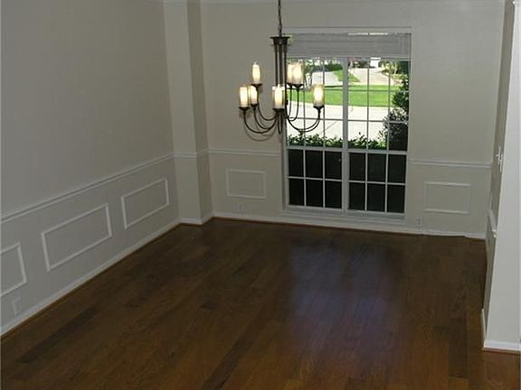 Updated Hardwood Flooring, Fresh Paint, Updated light fixture, Crown molding and plenty of room.