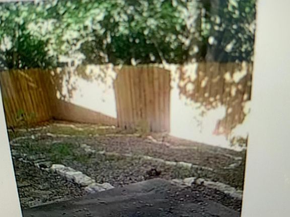 Fenced backyard ready for your small garden, dog, etc