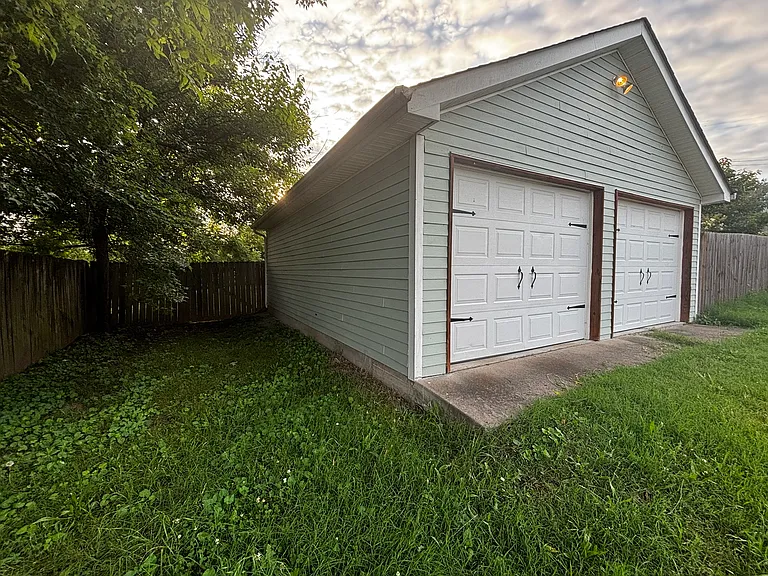25' long off-street parking next to garage with private gate entrance.