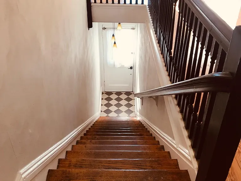 Stairwell Looking Down at Front Door