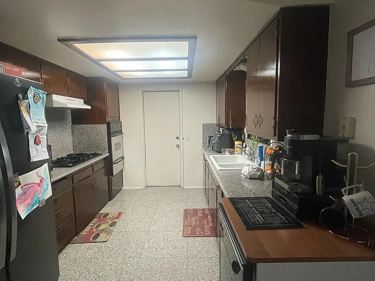kitchen is beig remodeled cabinets kitchen cabinets will be painted satin black new stainless steel door handles