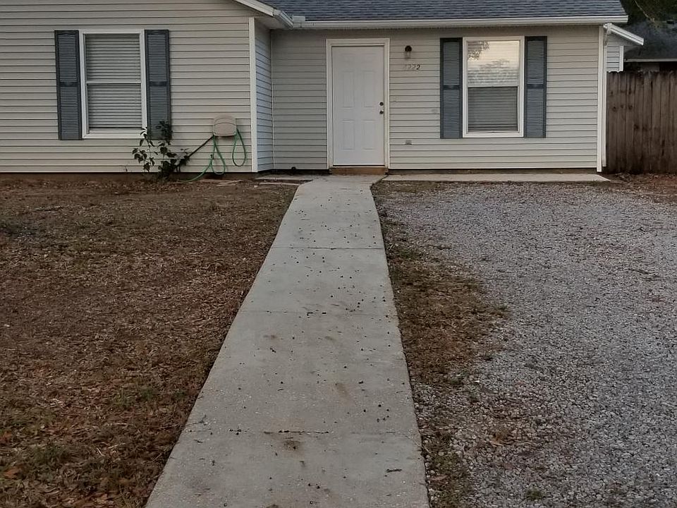 Apartment with gravel driveway