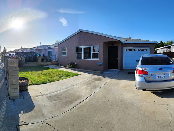 Front of house from brightside of property. Garage door is accessible to property owners half of garage.