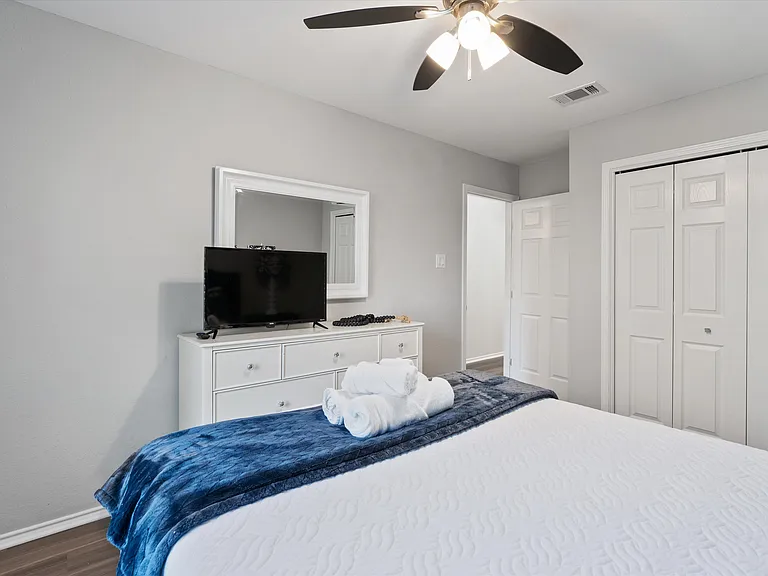 Secondary Bedroom Queen Plush Bed Full sized Dresser with Mirror and large closet