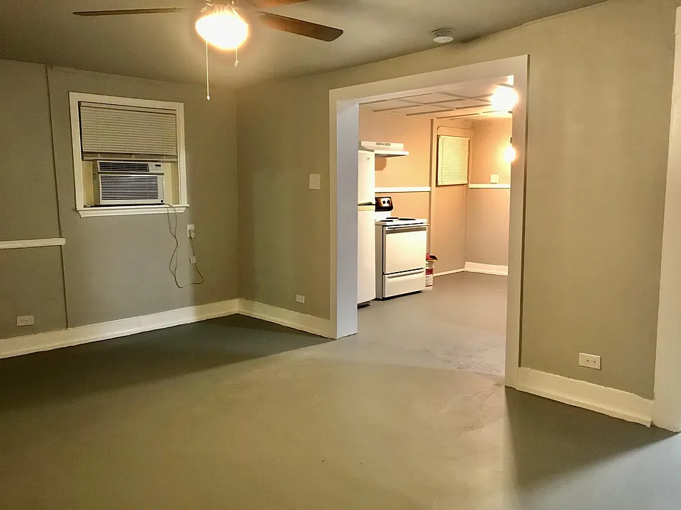 Living room opens to the eat-in kitchen..