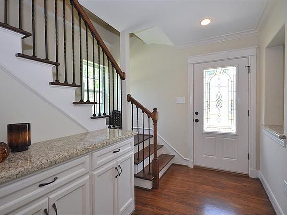 Come on in through the leaded glass door into the entryway of this stunning home