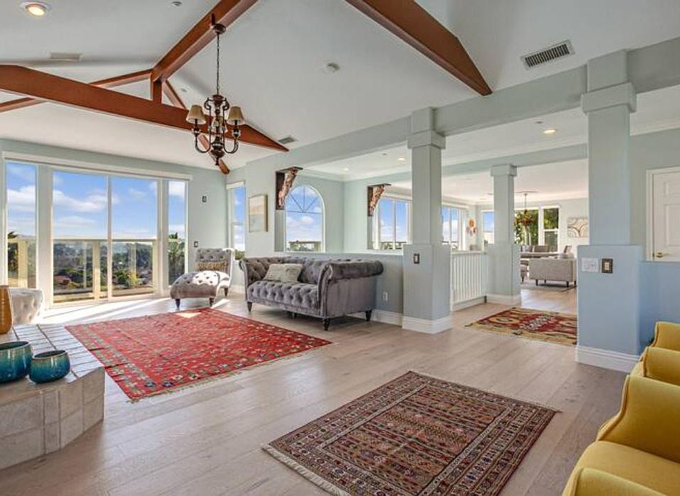Main level has two large living areas, vaulted ceilings and amazing views
