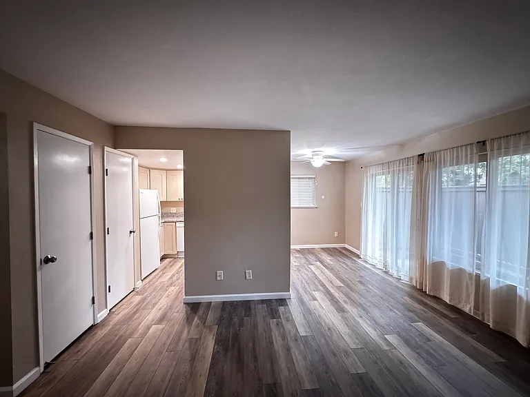 Family Room with view of the dining area on the far left next to kitchen