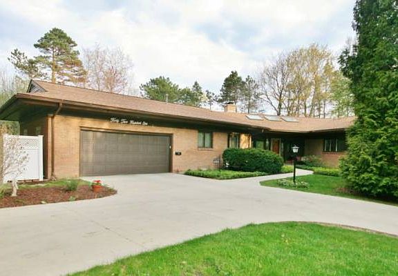 A two car garage with room for a third if you like. There is an added parking pad plus the roof and driveway are newer and in great condition.