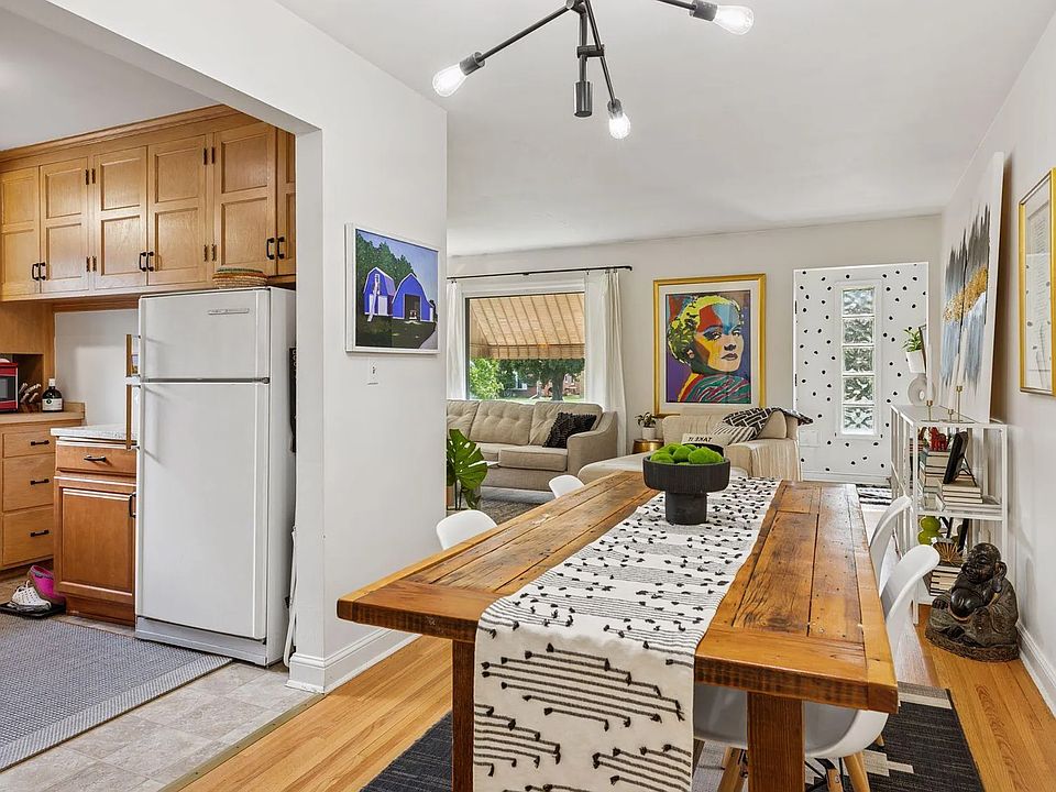 Dining room and a view into the kitchen and living room. **All pictures of the first floor are from the other unit, and mirror what this unit will look like when it's done.
