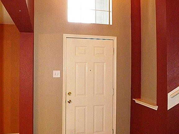 With high ceilings, the entry welcomes into a spacious interior with open views of several rooms so 