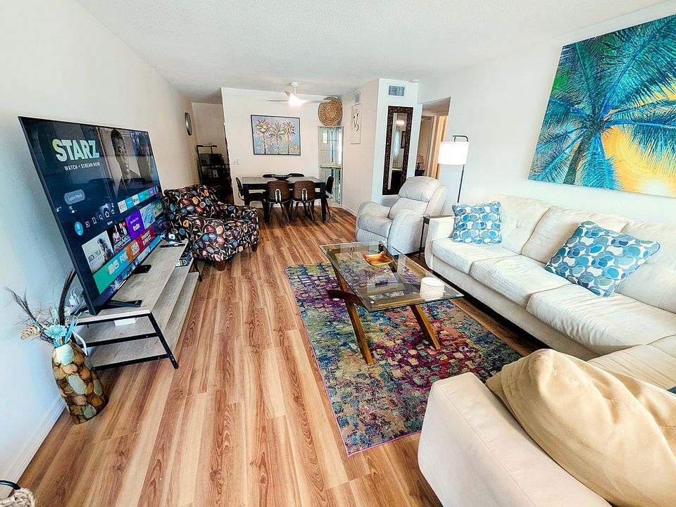 Refreshed living Room with brand new smart TV and flooring throughout