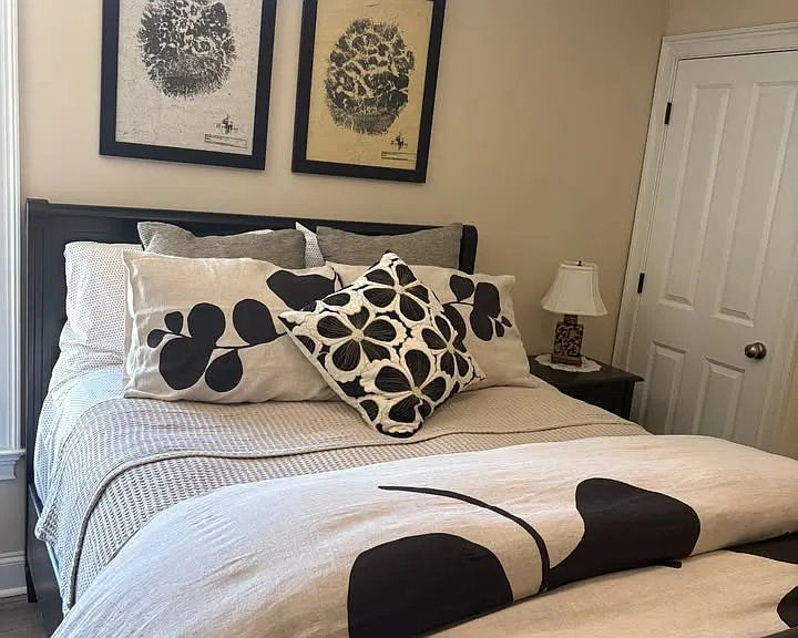Ceiling fan and light directly over bed.