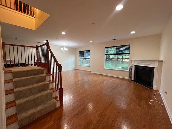 Lower level of home acees to 2nd level. Living -dining room combo with a gas fire place.