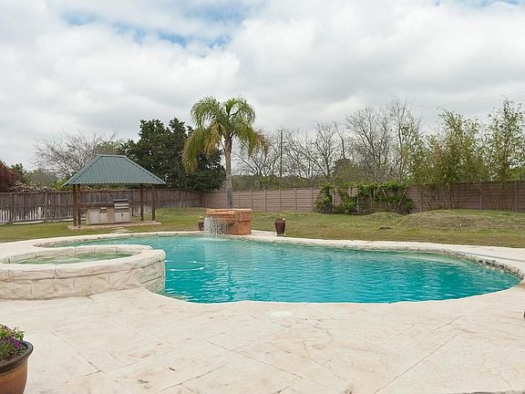 Entertain friends, family in this over-sized, very private backyard. Both pool and spa are heated and  a mosquito system manages both front and back yards.  Check out the outdoor kitchen.