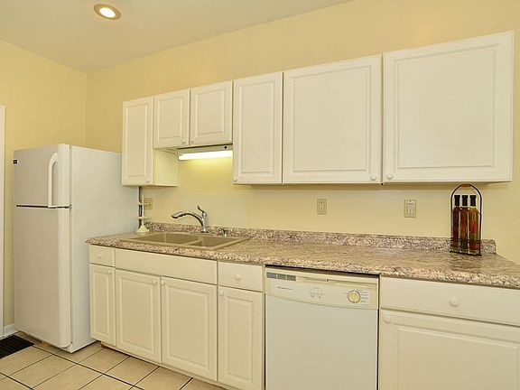 Kitchen with fridge and dishwasher