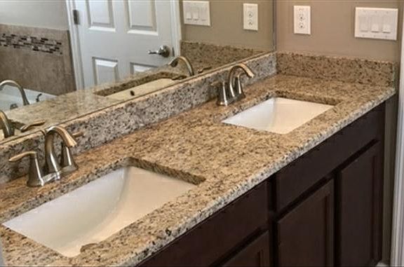 Undermount white sinks with granite countertop