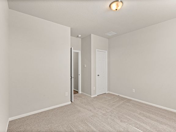 An additional view of the secondary bedroom and closet.