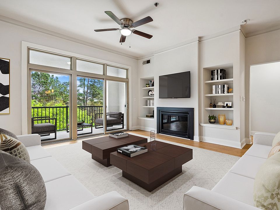 Living room with wood flooring and patio access