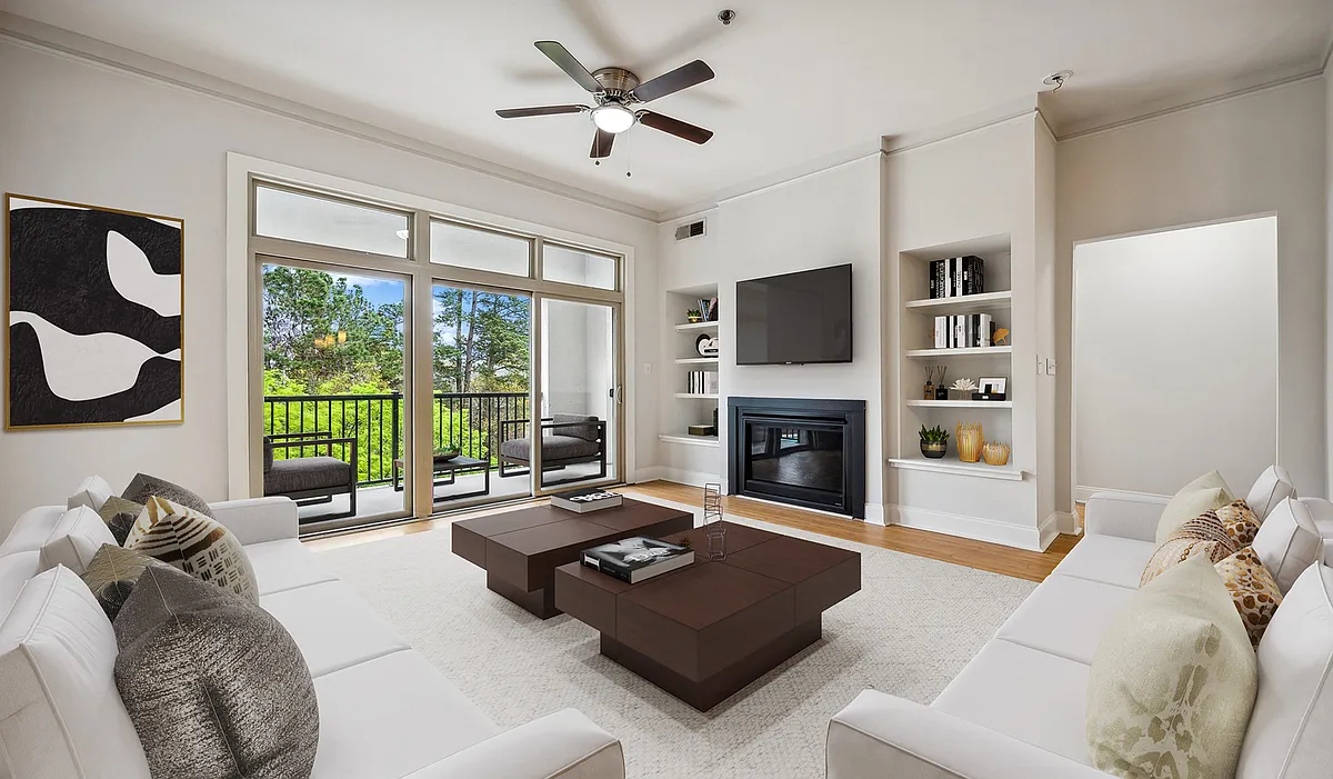 Living room with wood flooring and patio access - Tremont