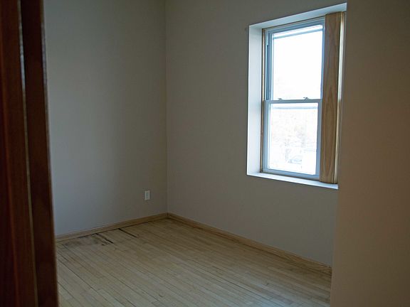 Another Bedroom with fresh paint and refinished hardwood flo